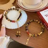 Accessorio geomanzia Nuovo stile nazionale cinese Super Fairy Maillard Tiger Eye Handsing Hands Cina-Chic Koi Elastico Elastico Regolabile Bracciale femmina