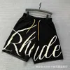 メンズトレンディハイストリートルーズドローストリングカプリのためのrhude編み花柄のセーターショーツ