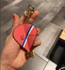 Keychains franceses para hombres y mujeres, elegantes llaves con patrones de animales de letras, hebillas colgantes vintage de alta calidad