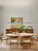 CHANDELIERS Pós -modernos minimalistas e leves restaurantes de luxo Chandelier Designer One Personagem Longo Front Descant