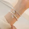 Chain Lily of the Valley Pearl Bracelet Double couche Bracelet Perle pour femmes conception de conception Bracelet de charme de bijoux coréen Y240420