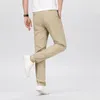 Pantaloni maschili in cotone elastico elastico classico casual classico business di colori dritti di quattro stagioni vestiti di marca nero kaki grigio