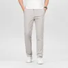 Pantaloni maschili in cotone elastico elastico classico casual classico business di colori dritti di quattro stagioni vestiti di marca nero kaki grigio