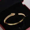 Pulsera de oro de lujo Cabeza de tigre para mujer Arpletas de brazaletes para hombres Diamantes Diseñador de diamantes Joyas Damas Cualquier situación Accesorios clásicos con caja