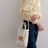 Bolsas de ombro Canvas Totes Bolsas e bolsas para mulheres 2024 MODAS MENHINAS COMPRIMENTAS FECIMENTOS DE PROMUTO DE ESTRIMEIRA DE ESTIMAGEM CRESSBIOL