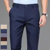 Męskie spodnie rozciągnij solidny czarny inteligentny swobodny męskie spodnie biuro Szybkie suche garnitur Spodnie Sprężyna jesień koreańskie spodnie proste 240420