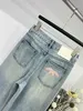 Designerin Frauen Mode Luxus Jeans Frauen Jeans Brief Grafik Jeans lässige lange, glatte Denim Mode gestickte Hose