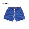 Män sommar avslappnad shorts snabb torkning fitness kort homme strand kvinnor styrelse elastiska midja solida gymkläder 240417