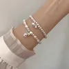 Chain Lily of the Valley Pearl Bracelet Double couche Bracelet Perle pour femmes conception de conception Bracelet de charme de bijoux coréen Y240420