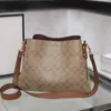 Luxury Designer Highs Highs Quality Texture Simple Texture Bag Michael Kadar Women's Backet Back 2023 New Fashion Cow-Wide Messagers Bag Bag de banlieue sac à main sac