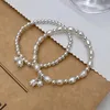 Chain Lily of the Valley Pearl Bracelet Double couche Bracelet Perle pour femmes conception de conception Bracelet de charme de bijoux coréen Y240420