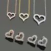 Дизайнерские ювелирные изделия женщин Алмазное сердце подвесные ожерелья Серьги из розового золота.