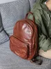 Backpack Retro Leather Men's Primeira camada de cheiro de gado de grande capacidade Trendência da moda Moda Mochilas bolsas escolares