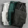 Pantalon pour hommes sèche rapide tissu respirant rétro couleur solide tendance fonctionnelle fonctionnel décontracté tridimensionnel coupé lâche jambe droite lo