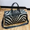 Duffel Çantalar Moda Seyahat Çantası Kadın Çantaları Büyük Kapasiteli Deri Stripe Duffle Big Tote Hafta Sonu Kadınlar İçin Gece Spor Salyası