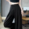 Pantalon féminin 2024 Fleur de sensation de conception d'été avec combinaison de taille haute concave et 3D à la jambe large