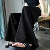 Pantalon féminin 2024 Fleur de sensation de conception d'été avec combinaison de taille haute concave et 3D à la jambe large