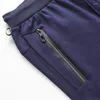 Pantalon masculin 2024 Brand Spring and Automne Pantalons Loissine Coton Couleur pure pour le pantalon d'étirement à fermeture éclair de poche masculine