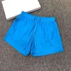 Masculino curto roupas de banho de alta qualidade designer de alta qualidade lente bolso de bolso curto casual shorts de natação ao ar livre de corrida casual secar rápido cp calça curta