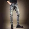 Herrfjäder nya motorcykel jeans, ungdomsmode, retro trend, temperament, smal passform, små fötter blyertsbyxor