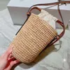 Lyxdesigner strandpåse singel axel crossbody väska liten hink väska kvinnors nya halm handvävd tygväska utomhus casual capacity shopping väska