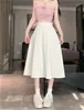 Jupes minimalistes longs pour les femmes 2024 plies de couleur solide inspire des femmes