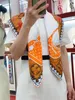 Designer di sciarpa in seta twill coniglio vecchio arancione arancione arancione arancione donna lussuosa m78081
