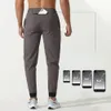 Pantaloni sportivi da uomo scambiati sciolti di fitness intrecciato in tessuto
