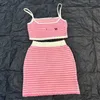 Tvådelt kläddesigner 24 sommar ny produkt rosa rand sling halva kjolen för kvinnor k9pp