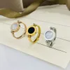 Designer sieraden luxe ring voor vrouwen mannen goud ringen shell zwart en wit dubbelzijdig roteerbare mode roestvrij staal Jewelle303Q