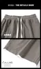 USA: s storlek Sommar utomhus Löst våffla Running Shorts Pocket Drawstring Design Bekväm andningsbara basket Shorts Gym HOMBRE 240412