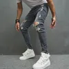 Mężczyźni Stylowe rozryte chude dżinsy ołówkowe spodnie streetwearu męskie dziury hip -hopowe rozciągnij Slim Denim Spodni 240417