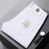 Designer di jeans maschile 2023 White Spring e Autunno New Slim Fit Small Fashion Brand Pants Casual Light MW3N