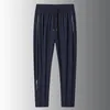 2024 hommes pantalons décontractés droits lâches pour hommes glace pantalon séchage rapide pantalon de poche zippé pantalon de jogging grande taille 8xl 240422