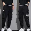 Pantalon masculin Classic Strtwear Casual Men Ribbons Harem Jogging Pantalging Male Slim Fit Spring Cargo Pantal