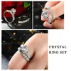 Con pietre laterali Shuangr Fashion Silver Coloy Couple Rings 2 Pcs Cryccon Crystal Set Uomini Bague di gioielleria da sposa