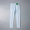 Mäns jeansdesigner 2023 Ny high end koreansk elastisk tryck ungdom Slim Fit Small Feet Casual Cotton White Pants Jam5