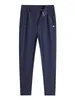 Pantalon masculin baisheng printemps et automne simple fat guy pieds