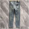 Jeans jeans pantaloni designer maschile di alta qualità uomini slim piccoli pantaloni di denim in cotone dritta di cotone figurano lettere logo triangolo ot14m