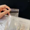 収納バッグジュエリー透明なバッグダストプルーフと抗酸化剤ブックリングイヤリングネックレスプラスチックバックルホルダー