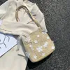 Schoudertassen boolaire grote capaciteit handtassen mode Koreaanse versie van wilde kanten witte bloemen en stro geweven tas
