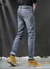 Designer de jeans masculin automne et hiver nouveau jeans de qualité masculine slim slim small pieds pantalon long mode lwh ht762f