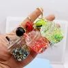 Keychains In Stock Cute Acrylic Oil-Filled Luminous Iceberg Cup Keychain Pendant Liquid Drift Bottle Gift Products Ornaments