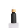 Förvaringsflaskor lyx tom 15/30/50 ml kosmetisk eterisk hårolja 1 oz nagelband matt svart glas droppflaska med bambu lock topp
