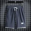 USA: s storlek Sommar utomhus Löst våffla Running Shorts Pocket Drawstring Design Bekväm andningsbara basket Shorts Gym HOMBRE 240412