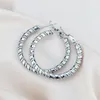 Boucles d'oreilles Hoop Europe et les États-Unis 2024 Twist Twist Circle sinueux Cercle de femme en acier inoxydable Luxury