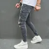 Mężczyźni Stylowe rozryte chude dżinsy ołówkowe spodnie streetwearu męskie dziury hip -hopowe rozciągnij Slim Denim Spodni 240417