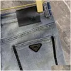 Jeans jeans pantaloni designer maschile di alta qualità uomini slim piccoli pantaloni di denim in cotone dritta di cotone figurano lettere logo triangolo ot14m