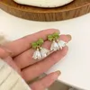 Backs kolczyki Bell Orchid Ear Clip bez otworów Wysokiej jakości prosta koreańska biżuteria Lekkie luksusowe małe świeże bajkowe akcesoria