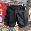Shorts d'été Man Floral Printed Gym Sports American Korean Beach Sauthouet pour les hommes Pantalons de cargaison de couleur noir massif LOBE 240423